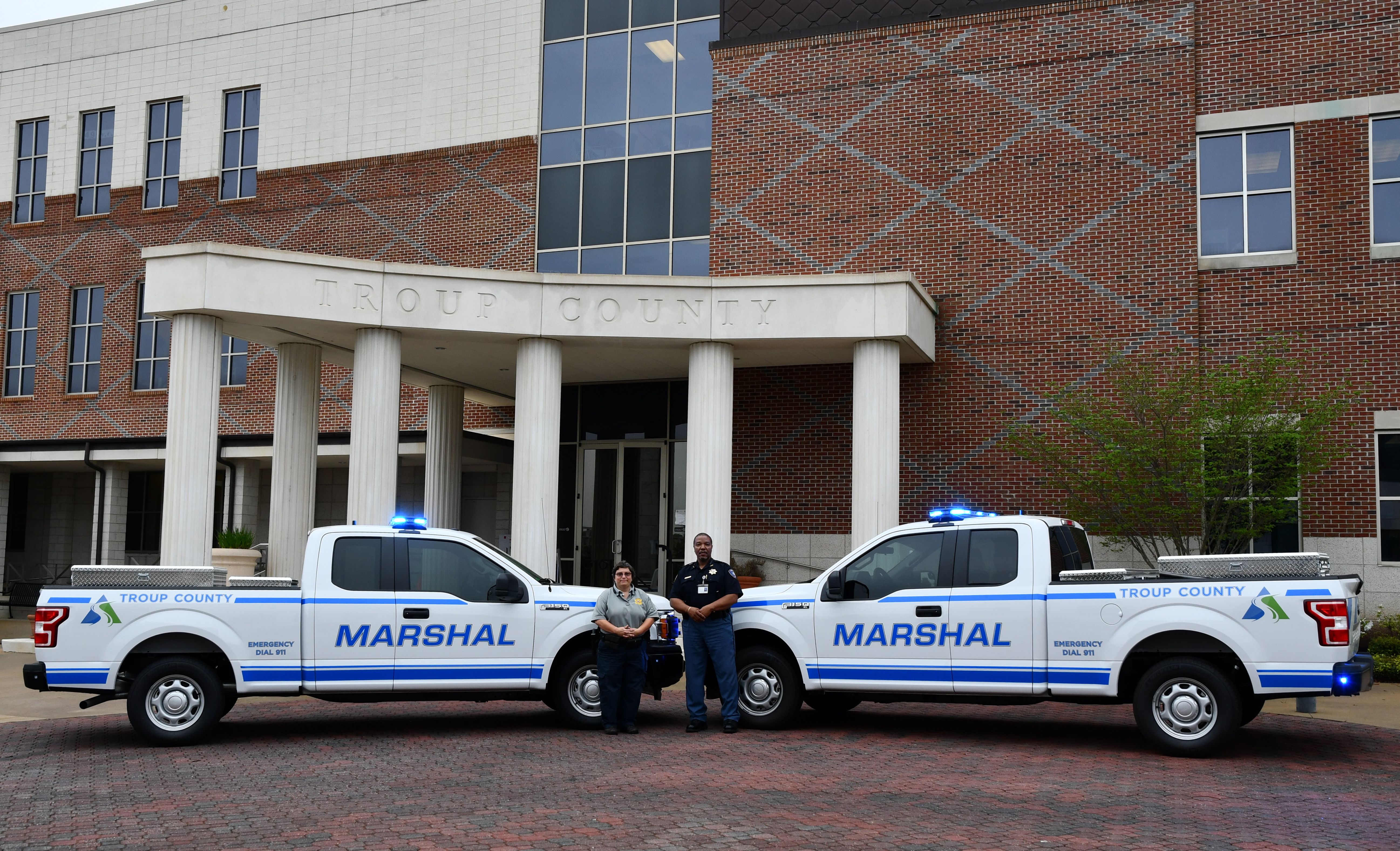 Marshal trucks in front of the Troup County Government center